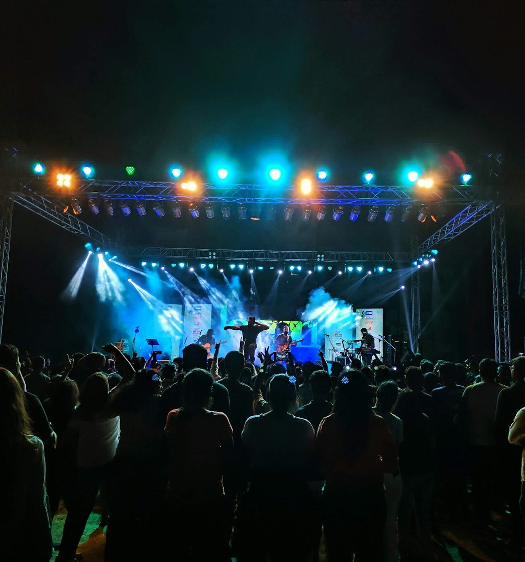 Concert stage with colorful lights during a live music performance