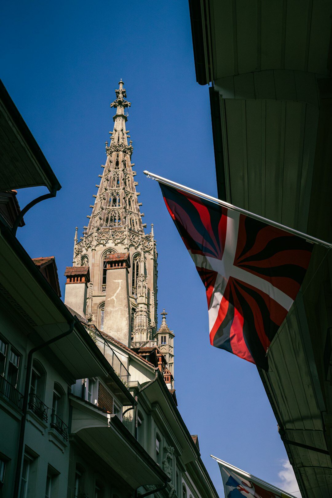 Swiss Bundeshaus parliament building in Bern with flags waving