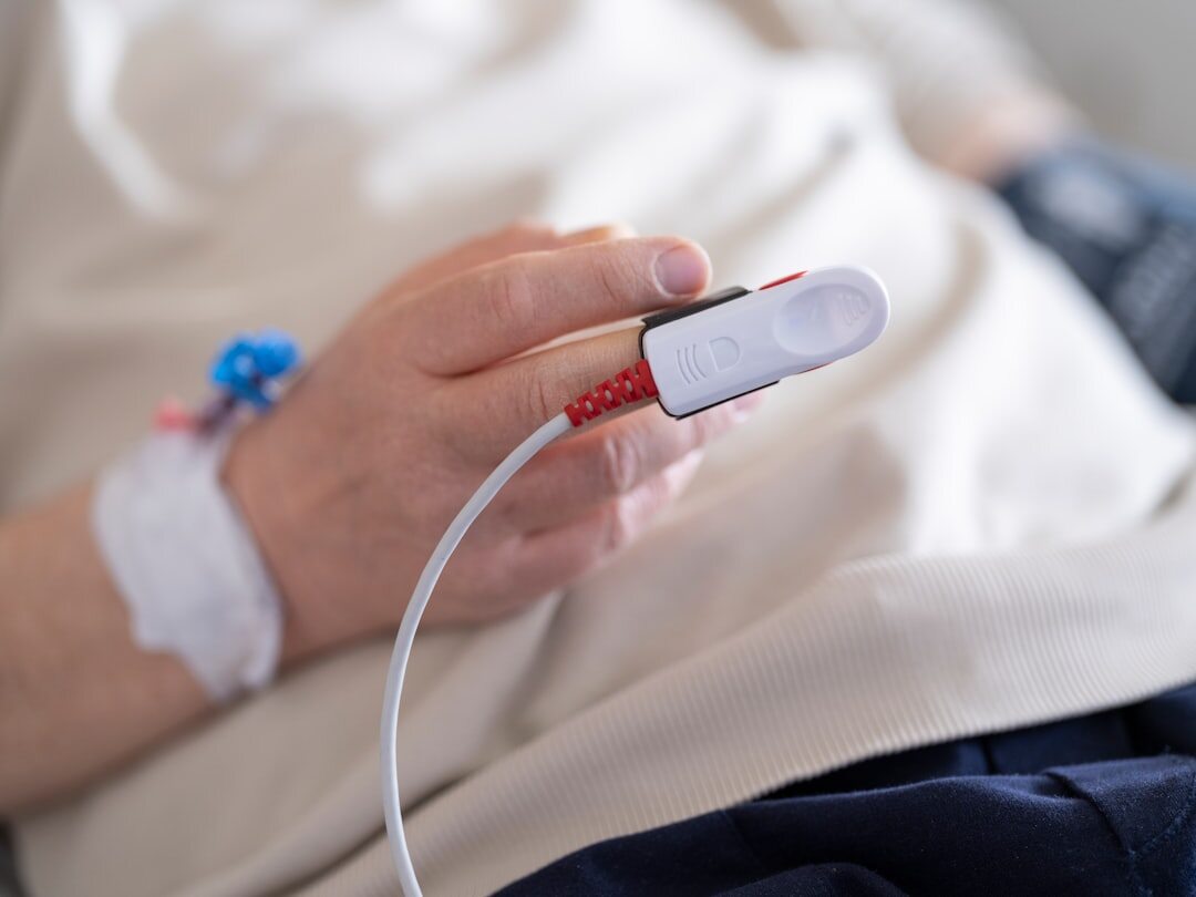 woman in hospital bed recovery