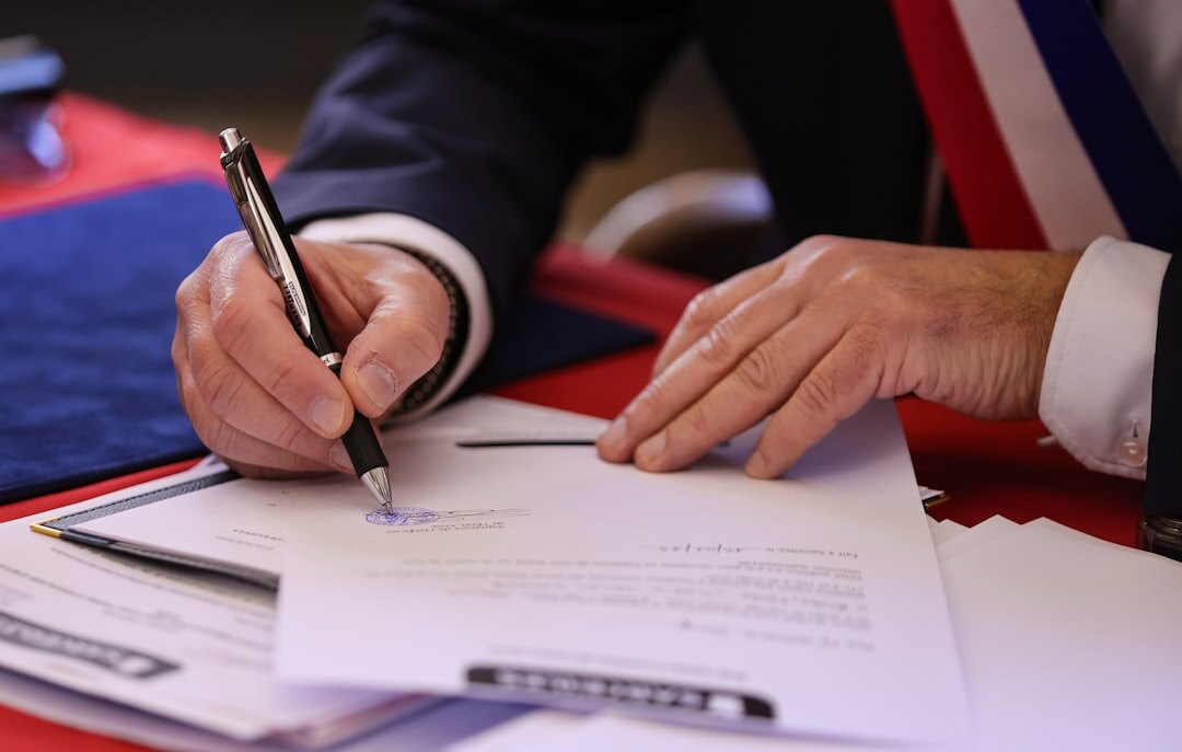 businessman signing check